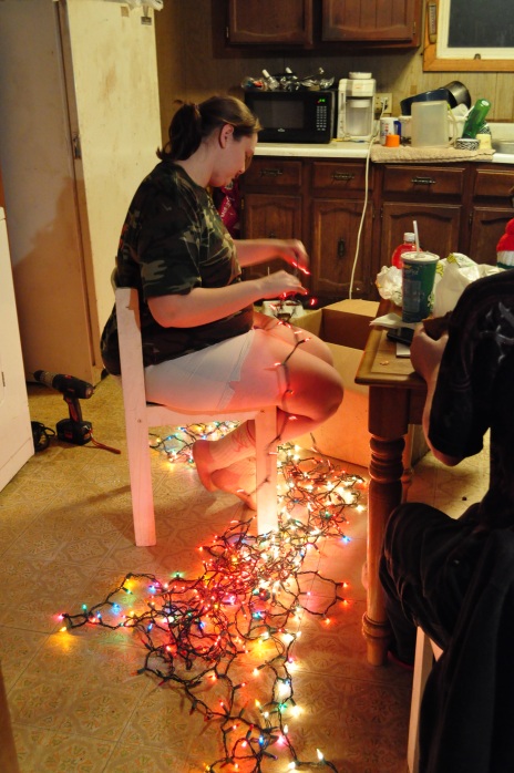 Cathy Sheldon sits and sorts through Christmas lights. She found out she was pregnant with her boyfriend, Aaron, a little over a month ago. "I'm pretty excited but my mom had different feelings on it," Cathy says, "Being that my sister just had a baby, too."